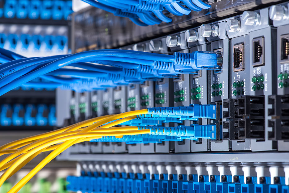 Network switches and patch to illustrate a case story in which NorthWest Techies redesigned the network of a company in Salem Oregon to provide better performance and reliability